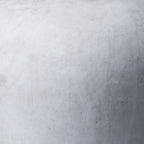 Close-up of the vase surface showing soft grey mottling, fine pale lines and small darker marks.