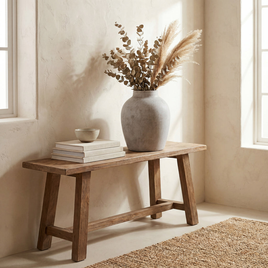 Diffuse Shoulder Vase styled with dried leafy stems and feathery grasses on a wooden console beside cream books and a small bowl.