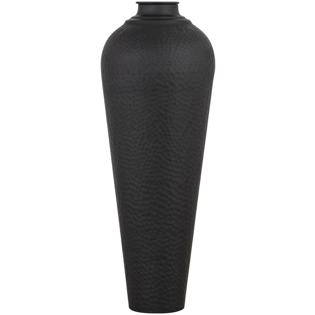 Front view of a tall matt-black vase with a tapered body, rounded shoulders, dimpled surface and flat circular cap on a white background.