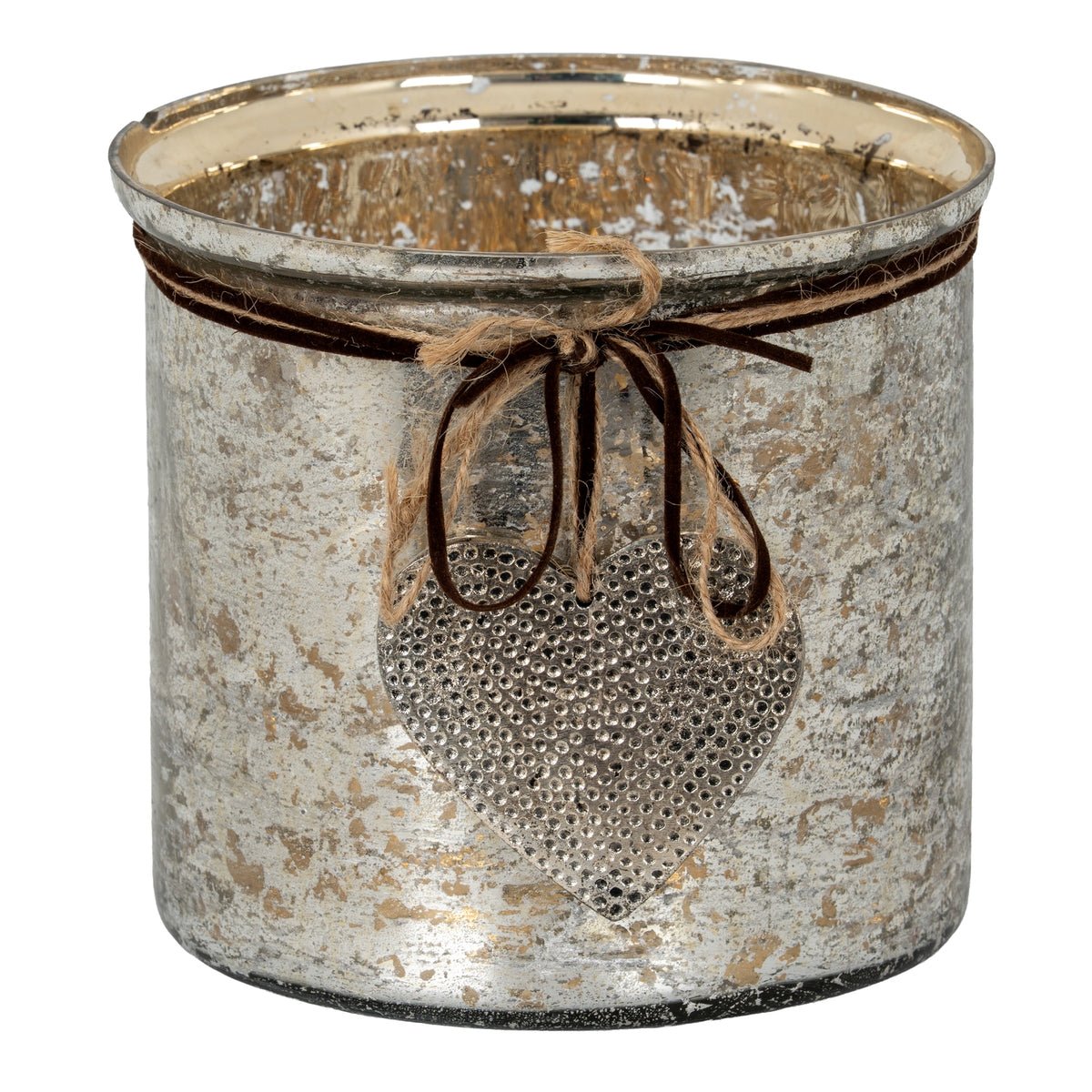 Broad cylindrical candle holder with a mottled silver and gold-toned surface, twine and dark cord bow, and hanging dimpled heart.