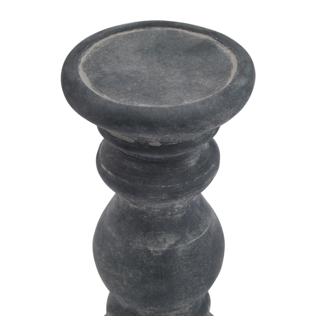 Close view from above of the candle holder's shallow top dish, with a rounded rim and pale distressed markings around the inner edge.