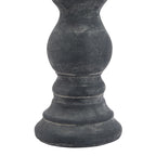 Detail of the candle holder's rounded lower stem and stepped foot, showing pale speckling and lighter lines across the dark grey ring details.