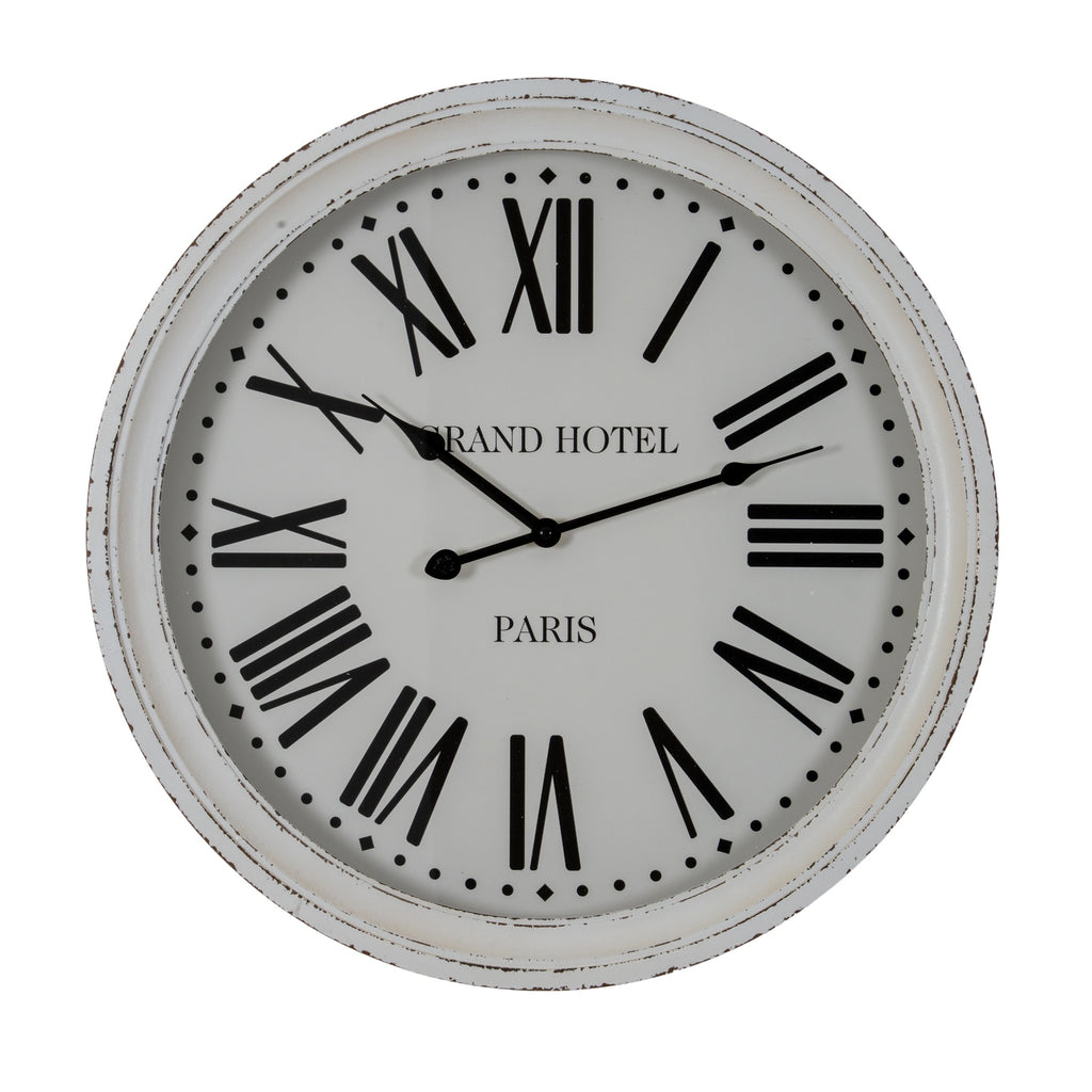 Front view of the round white wall clock with a distressed rim, black Roman numerals and GRAND HOTEL PARIS lettering.