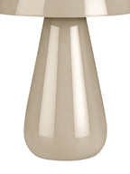 Close view of the lamp's tapered beige base and rounded foot beneath the lower edge of the glossy dome shade.