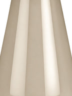 Tight detail of the beige lamp base showing elongated reflections across its smooth curved surface.