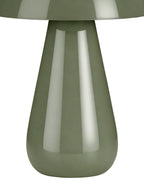Close view of the glossy green tapered lamp base and rounded foot beneath the edge of the dome shade.