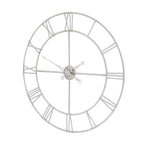 Angled view of the silver-toned clock showing its circular rails, flat numeral bars and cross-shaped centre bracing.
