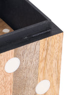 Close view of the open box corner, showing the dark lining, raised rim, wood grain and white resin dots.