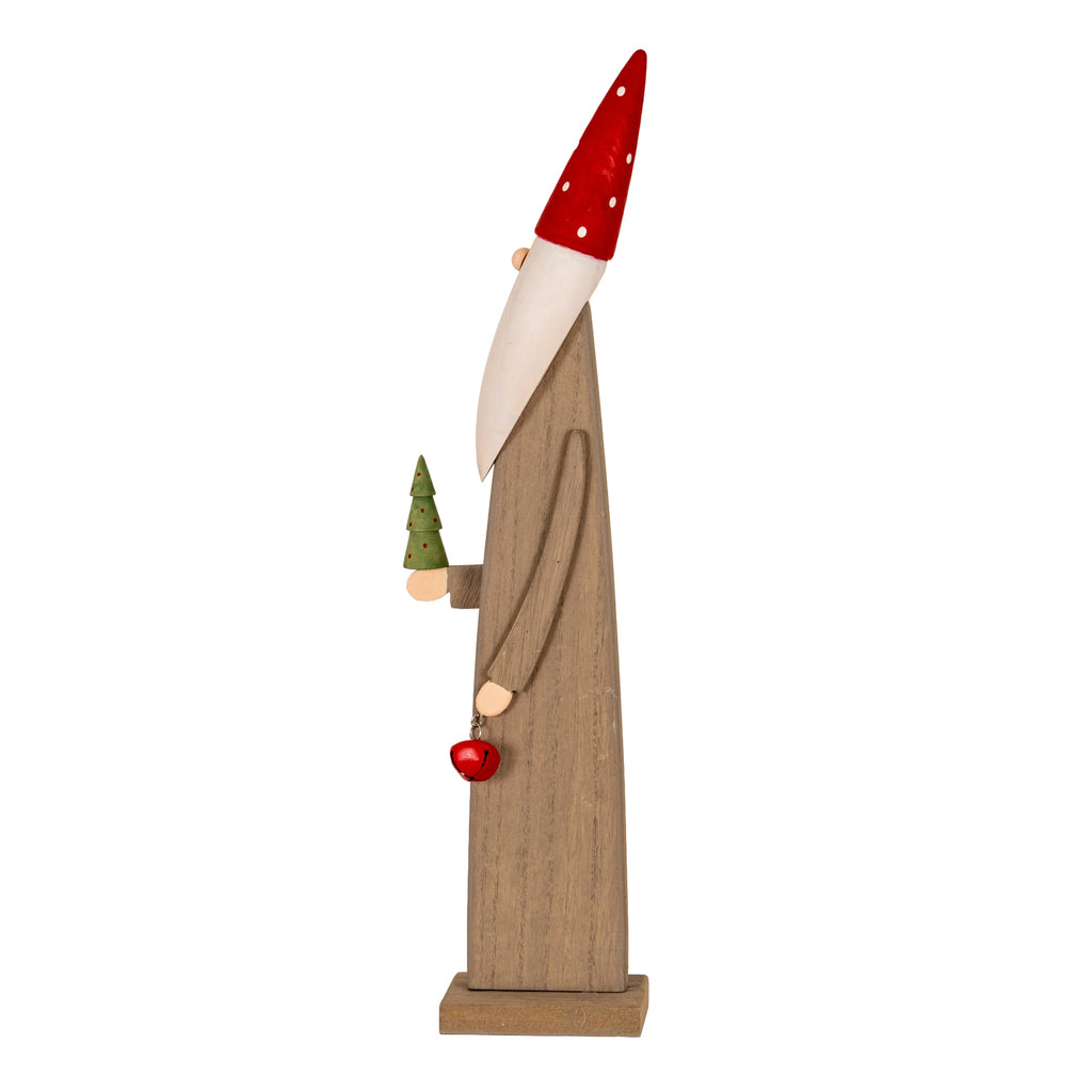 Side view of the slender elf figure showing its long arm, red bell and miniature green tree beneath a pointed spotted hat.