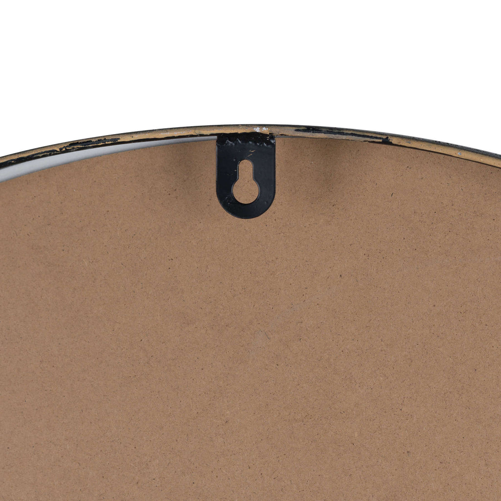 Rear detail of the black keyhole hanging bracket at the clock's curved top edge.