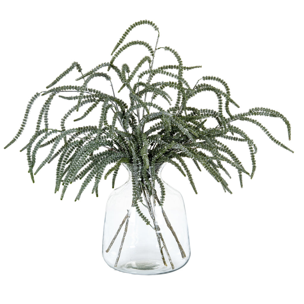 Silver-finished artificial amaranthus stems arranged in a clear vase, with green fronds cascading outwards against white.