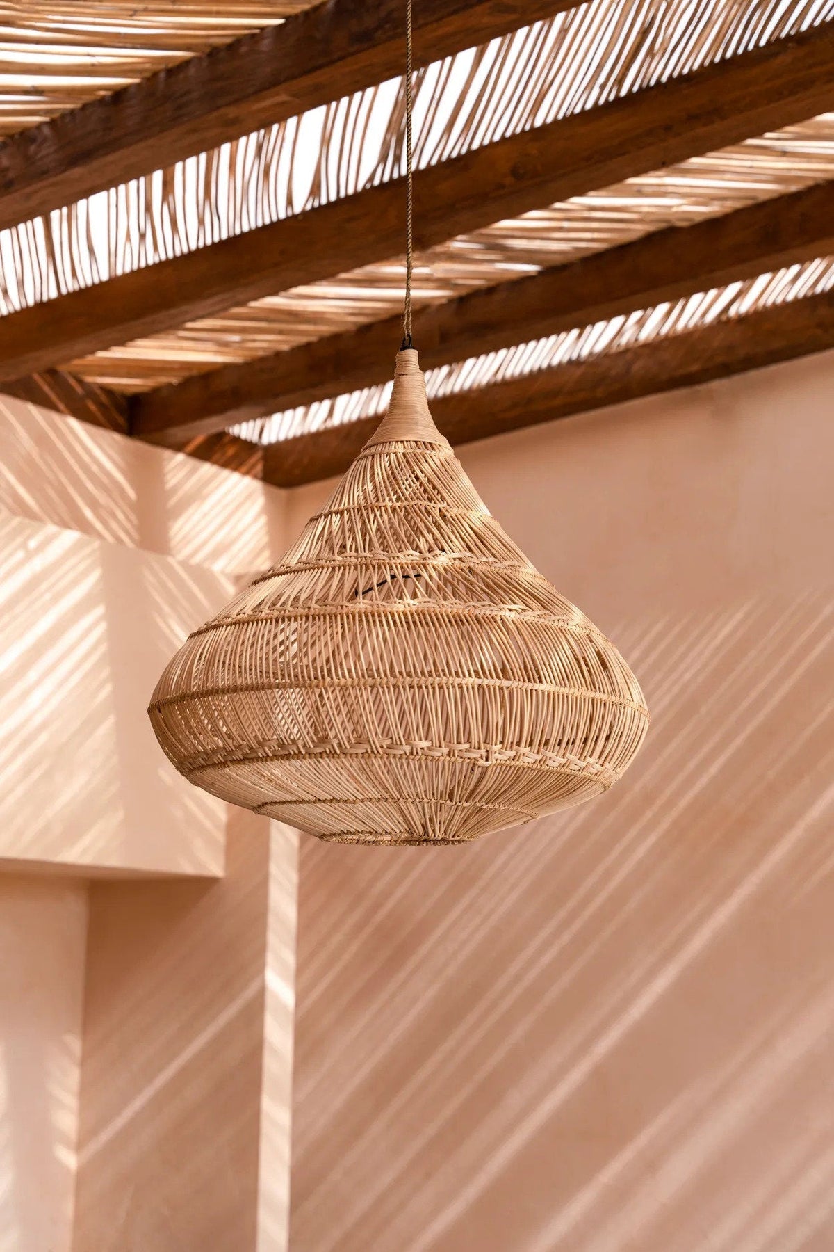 Drop Rattan Pendant Light – Natural, Large — styled in a warm interior