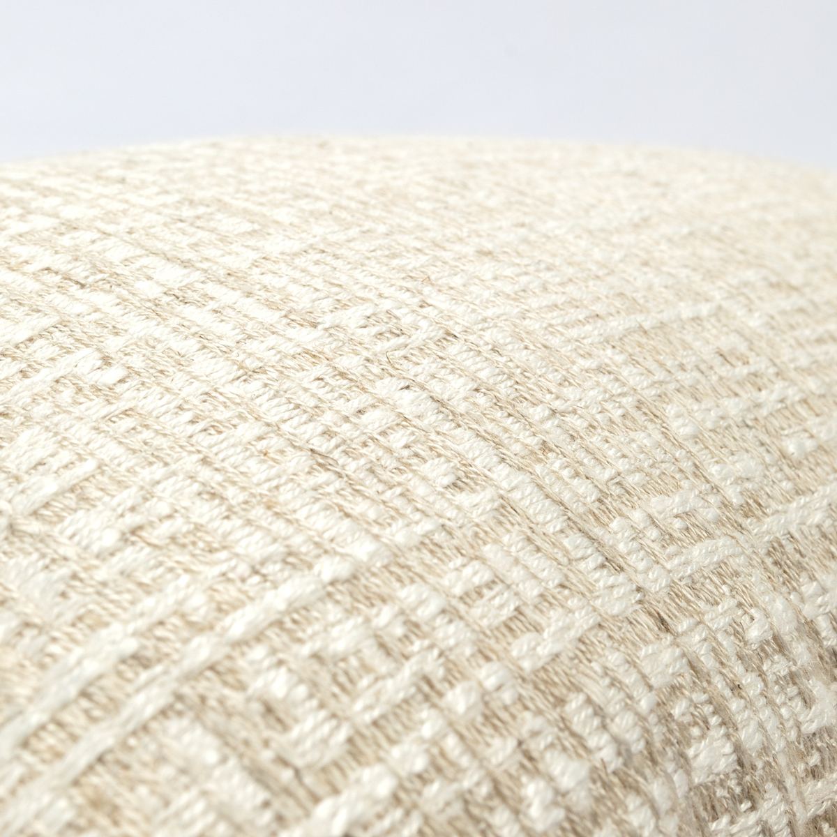 Close-up of Elara cushion cream and beige woven texture