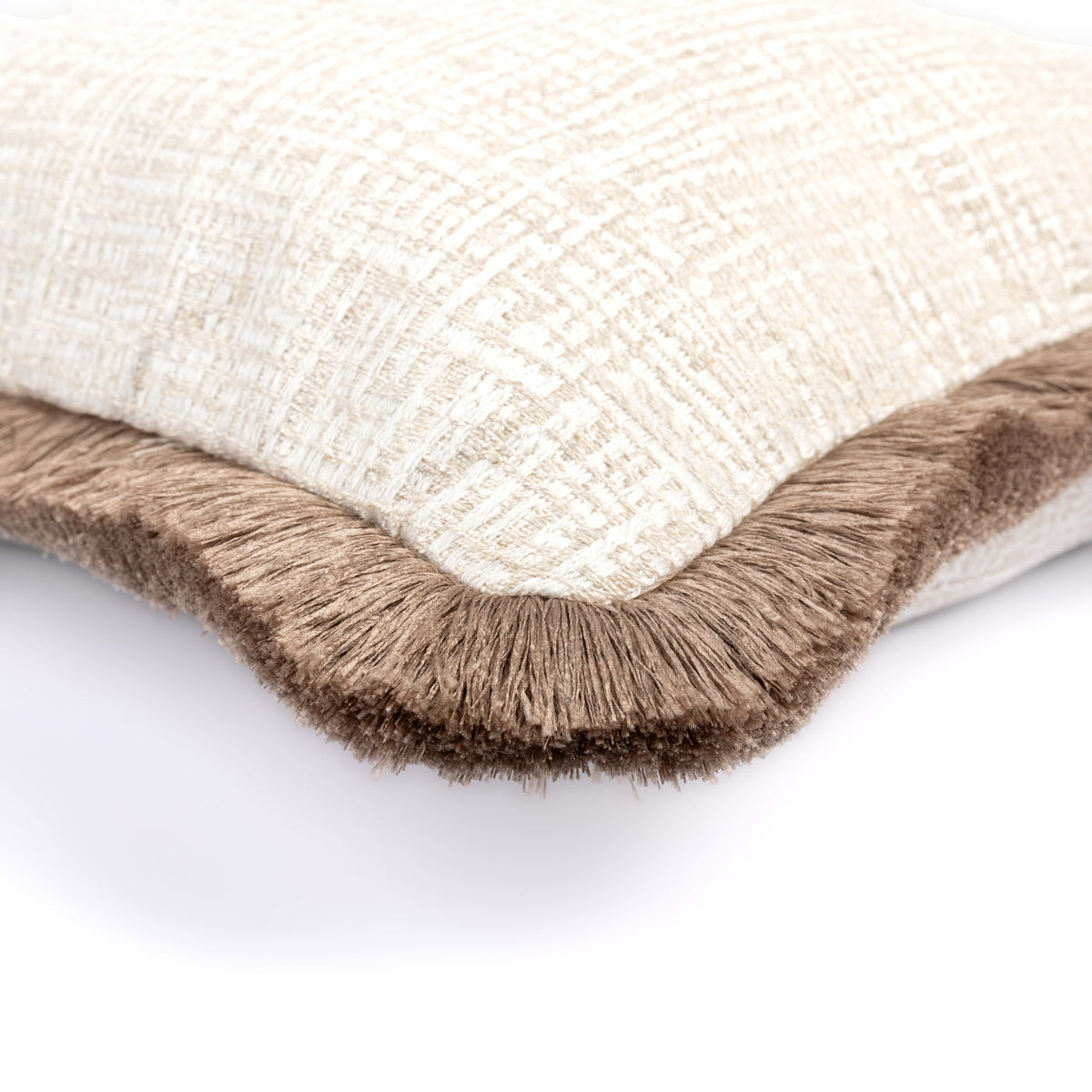Close-up of the Elara Cushion showing its neutral geometric weave and brown fringe