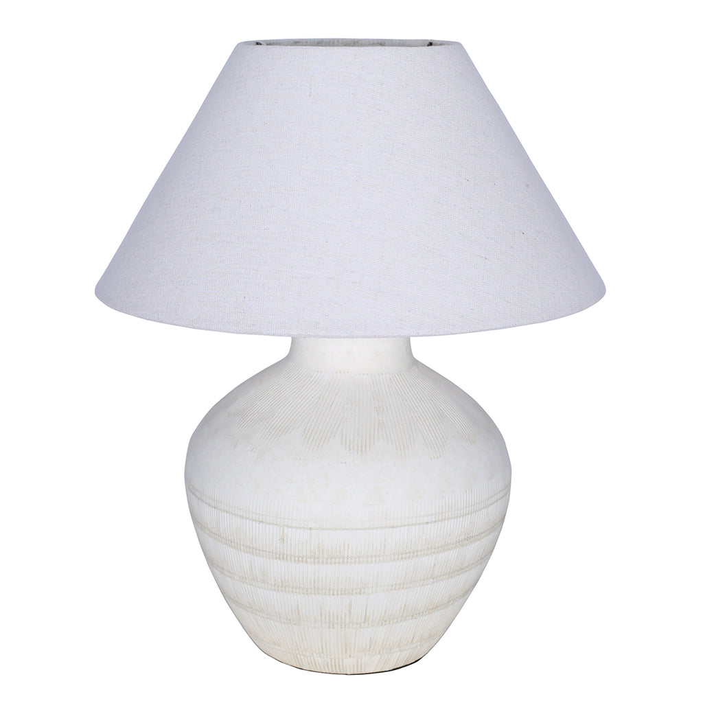 White table lamp with a rounded etched ceramic base and wide tapered fabric shade on a white background.