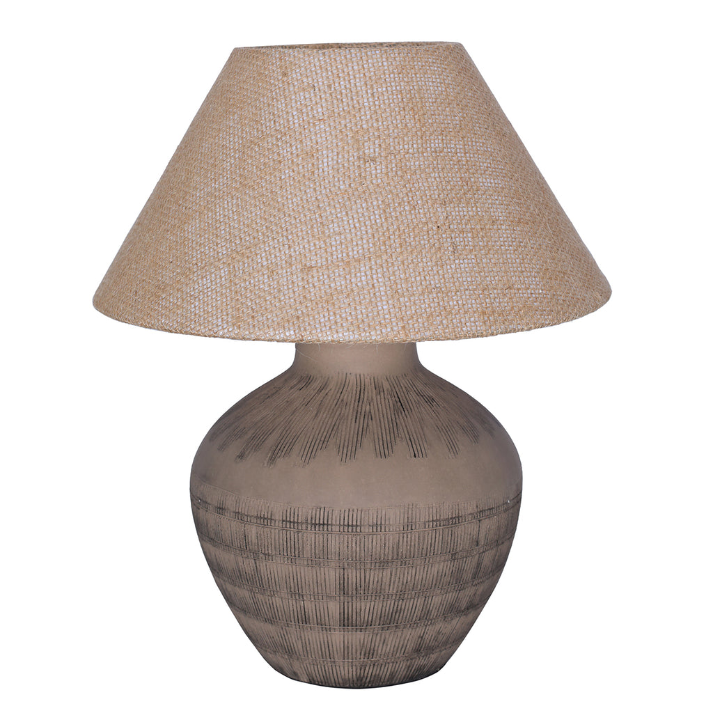 Brown table lamp with a rounded etched ceramic base and wide, tapered beige hessian shade on a white background.