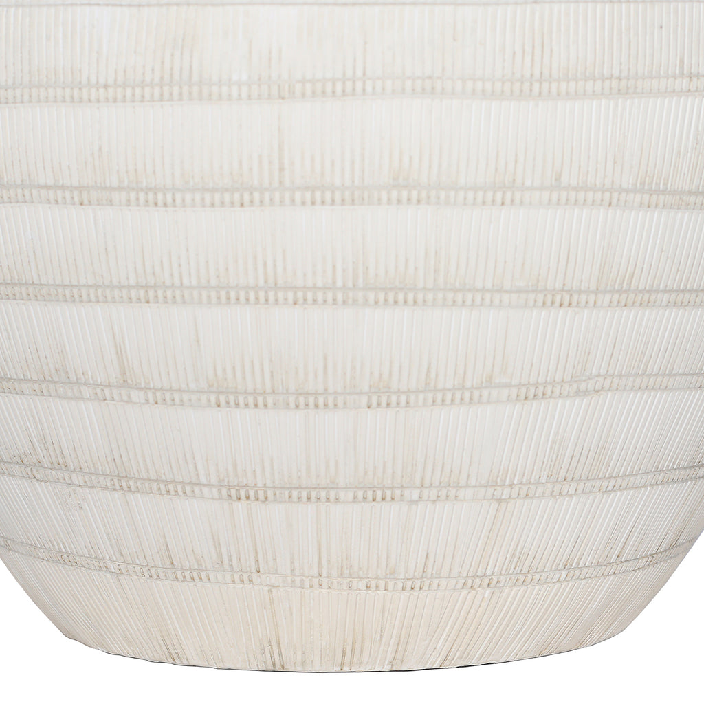 Close-up of fine vertical grooves crossed by horizontal bands on the lower white ceramic lamp base.