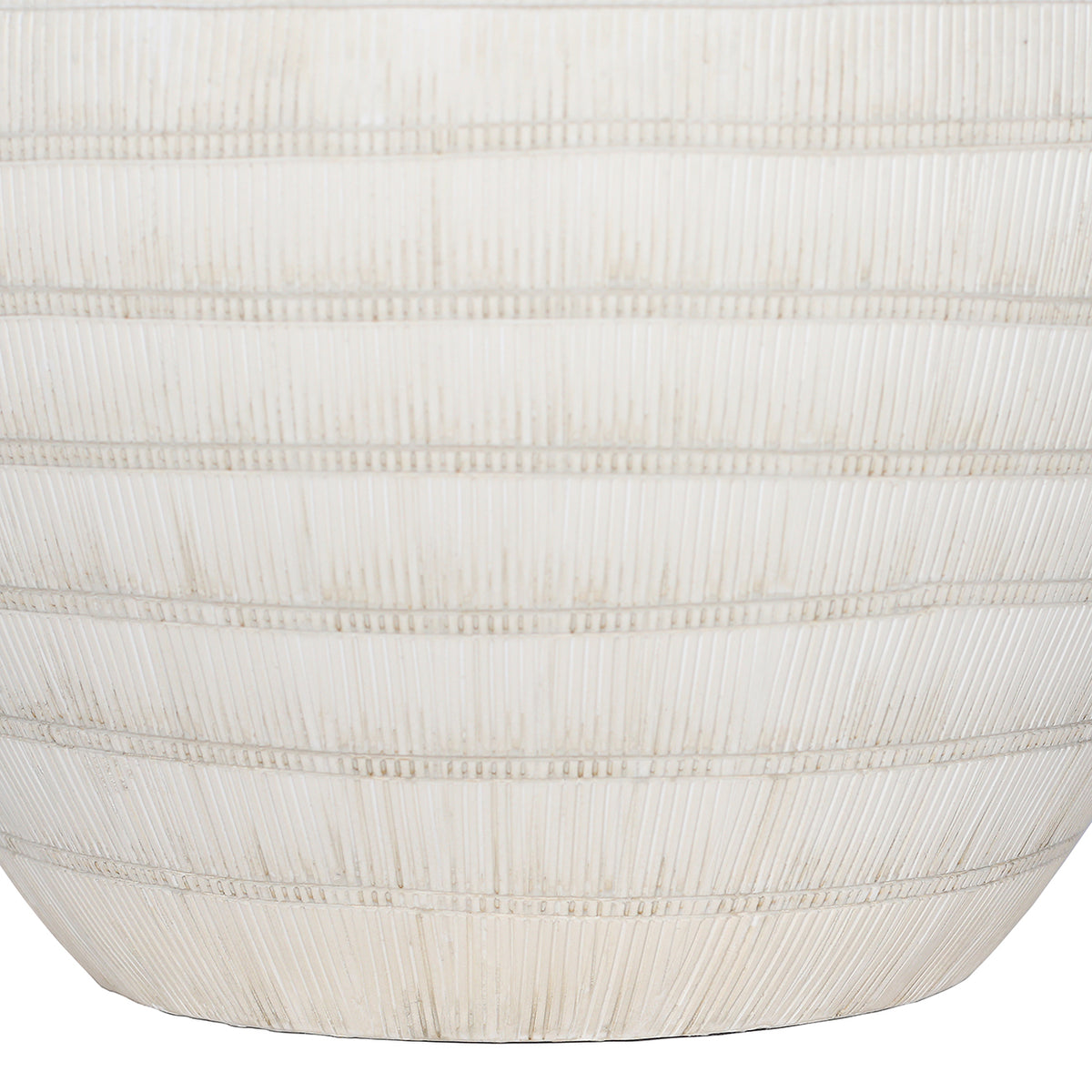 Close-up of fine vertical grooves crossed by horizontal bands on the lower white ceramic lamp base.