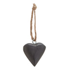 Charcoal heart with soft highlights across its rounded upper edge, a silver-coloured eyelet and a textured tan hanging loop.