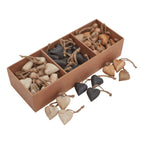 Pale tan, charcoal and warm brown heart decorations shown in a three-compartment brown tray, with loose hearts arranged beside it.