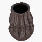Brown faceted vase viewed from above at an angle, showing its open mouth and textured sides.
