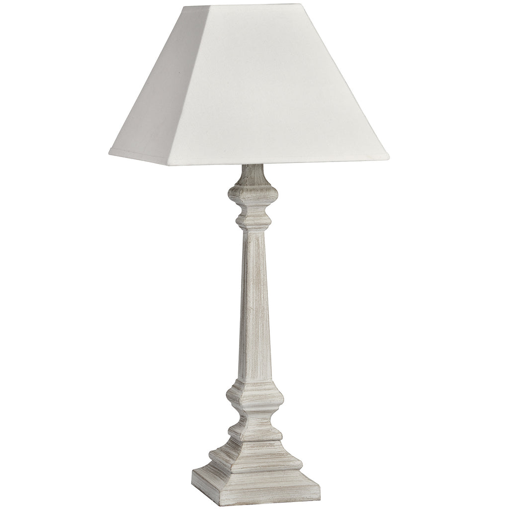 Faceted Rise Table Lamp with a pale tapered square shade, slender faceted stem and stepped square foot on a white background.