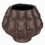 Angled view of the faceted brown vase showing its wide opening, dark interior and curved body.