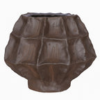 Front view of a squat deep brown vase with irregular facets and fine incised lines on a white background.
