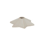 Low angled view of the cream star candle holder, showing the raised central socket and sloping faceted points.
