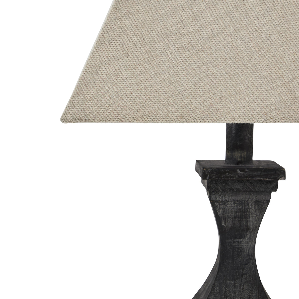 Close view of the shade's pale woven texture above the dark neck, stepped collar and narrow faceted waist.