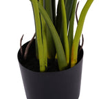 Close-up of the faux Tora plant base, with clustered green stems and brown shoots emerging from dark filling in the black pot.