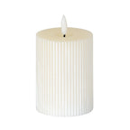 Warm-white ribbed LED candle on a white background, with a shallow top recess and white flame-shaped element on a short dark stem.