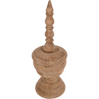 Wooden finial sculpture viewed from above at an angle, showing the circular shoulders and carved sections of the crown.