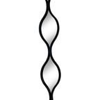 Close front view of two leaf-shaped mirrored sections and the narrow crossing point where their black frames meet.