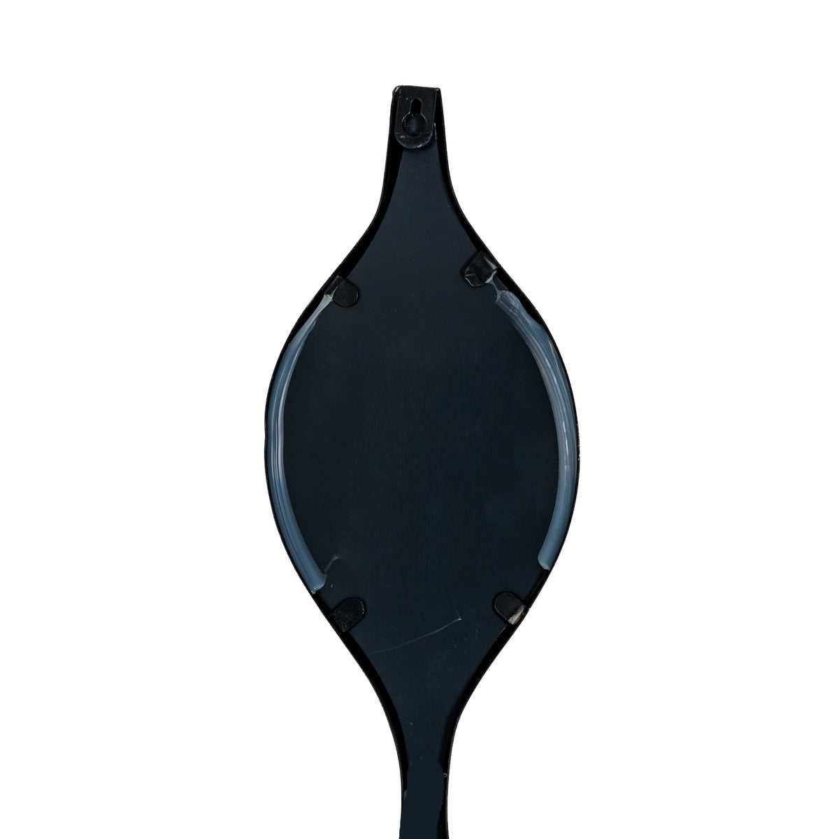 Rear detail of a leaf-shaped section with a black backing, small edge tabs and a keyhole-shaped opening at the top.