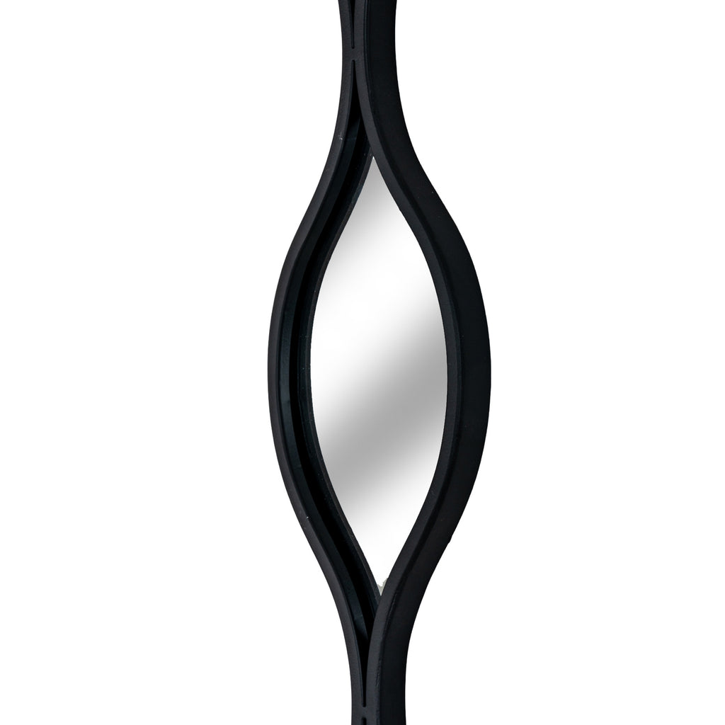 Angled close-up of one pointed mirror section showing the curved black border and reflective surface.