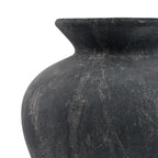 Close-up of the vase's curved shoulder and flared neck, showing pale irregular markings on the matte dark grey surface.