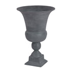 Angled view of the grey urn showing its open flared rim, curved bowl and stepped square base.
