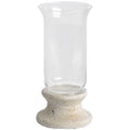 Candle lantern on a white background, with an empty clear flared sleeve above a mottled cream-grey pedestal and broad circular foot.