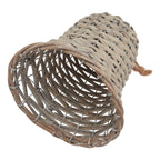 Woven bell decoration lying on its side, showing the wide open rim, darker hollow interior and silver-toned framework between the weave.