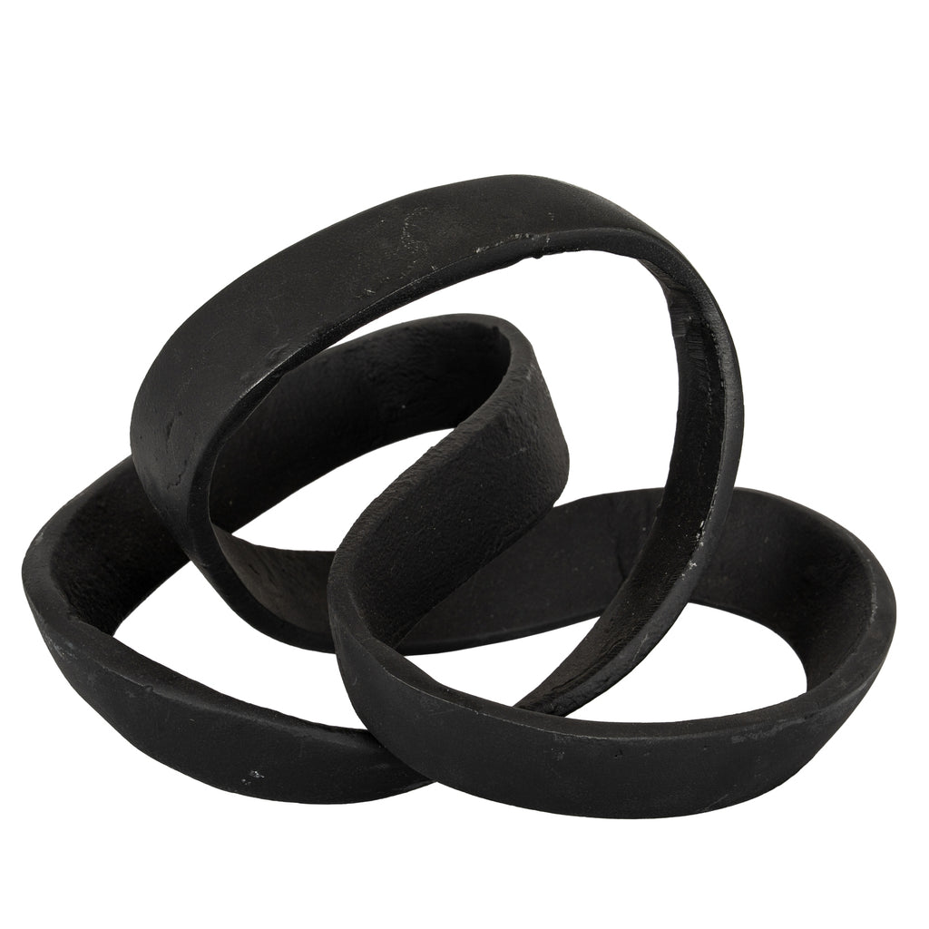 Black knot ornament with a broad upper loop and overlapping flattened bands on a white background.