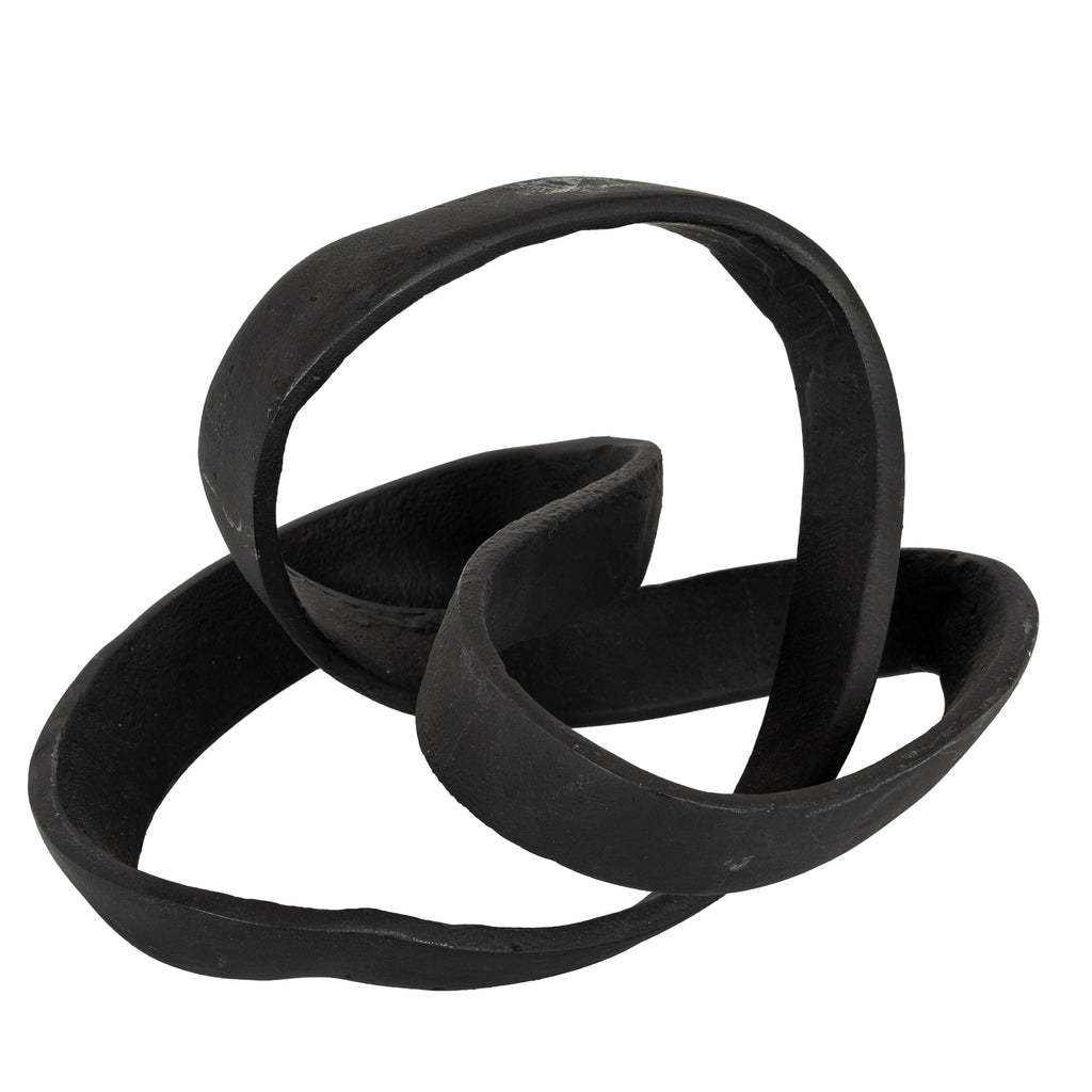Angled view of the black knot ornament, showing its tall open loop and sweeping lower curves.