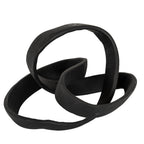 Angled view of the black knot ornament, showing its tall open loop and sweeping lower curves.