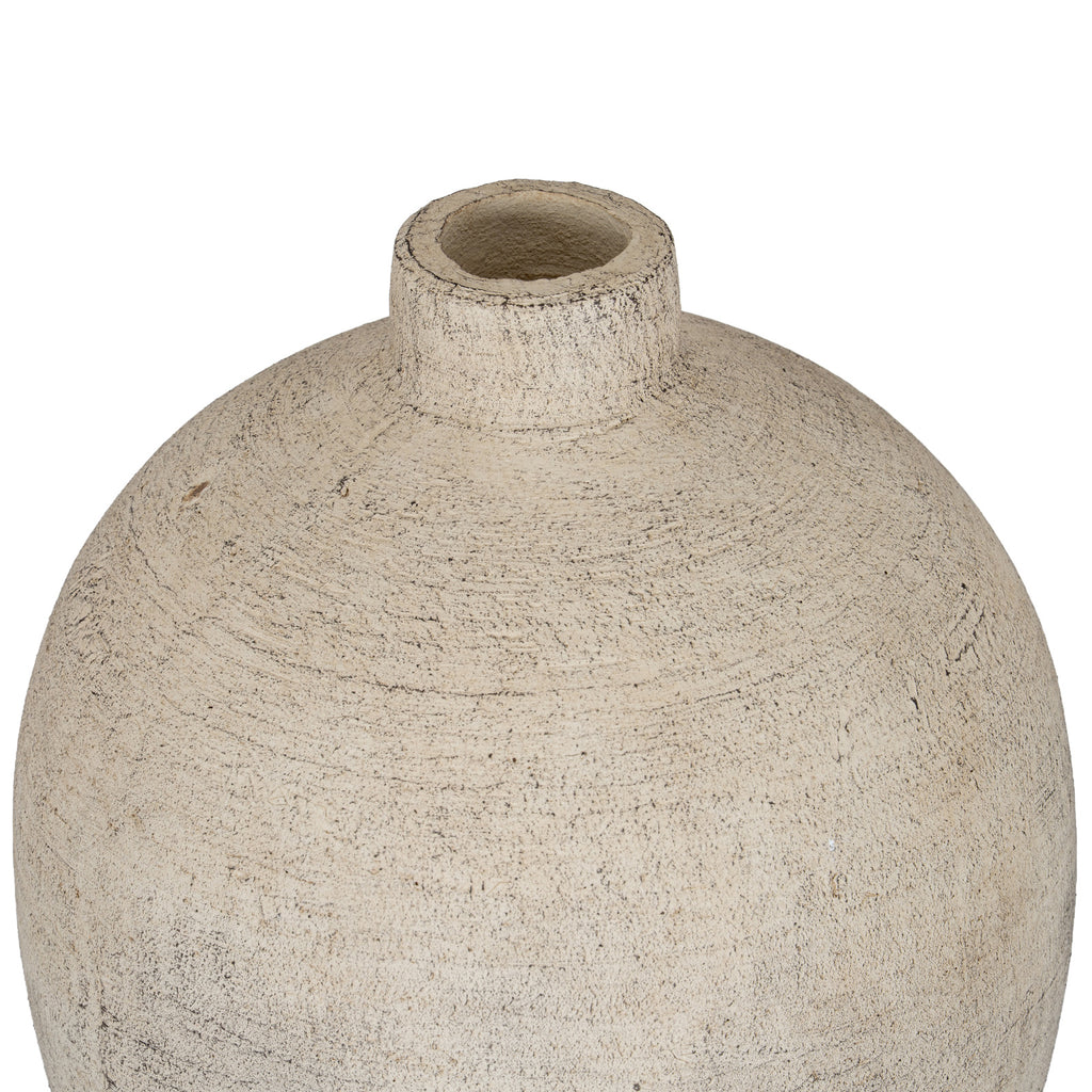 Close view from above of the vase's circular opening, short neck and textured cream shoulders with dark markings.