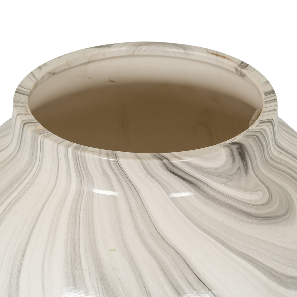 Close view of the planter's circular opening and short rim, with fine grey bands curving over the glossy white shoulder.