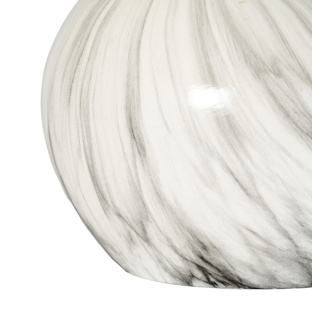 Detail of the planter's lower curved body, showing pale grey streaks and darker bands sweeping towards the flat base.