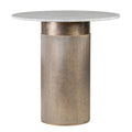 Round bistro table with a pale marble top and champagne gold drum pedestal, showing a smooth upper band and fluted lower section.