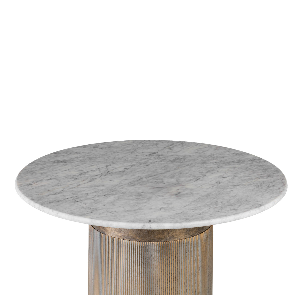 Angled view across the round marble tabletop, showing grey veining and a rounded edge above the gold pedestal.