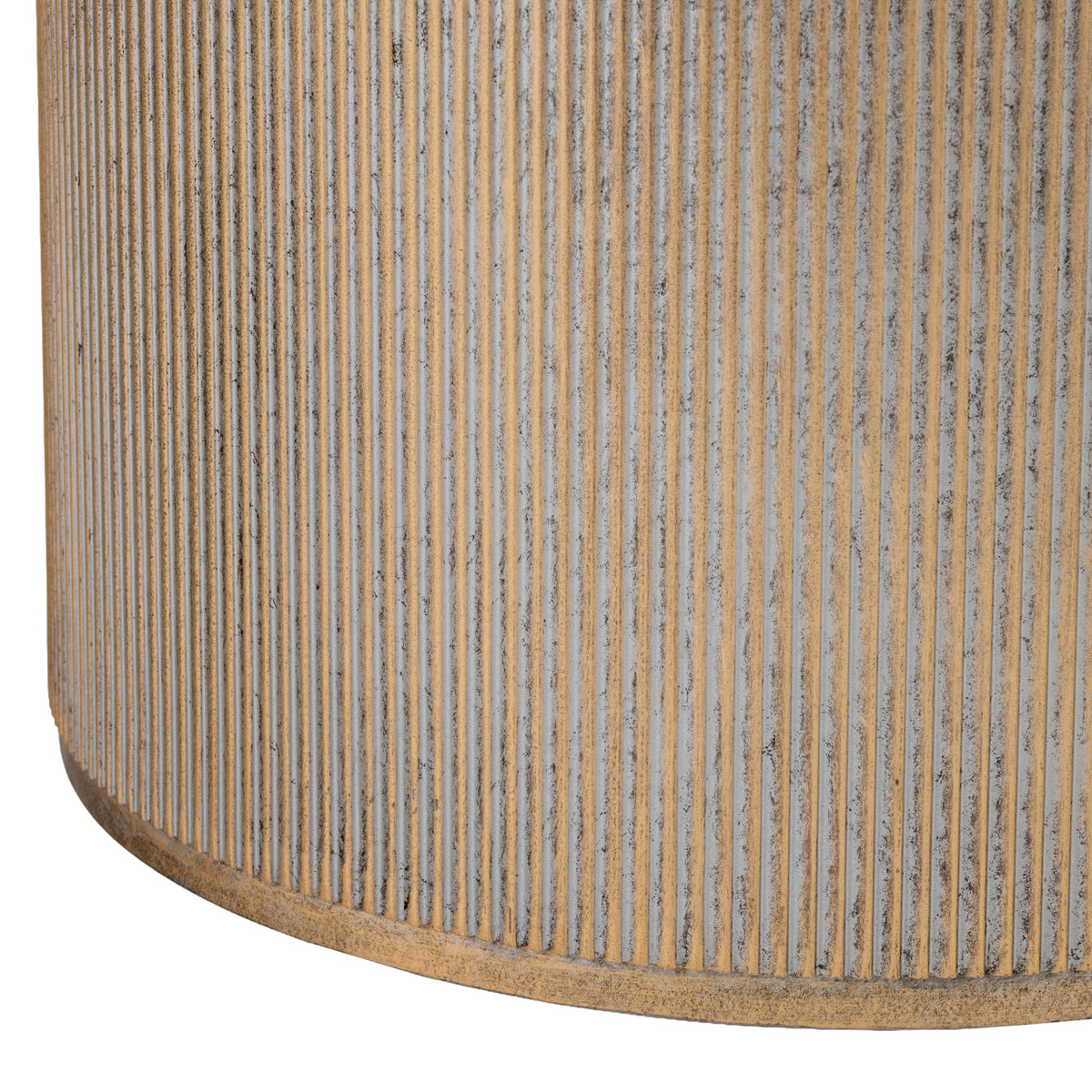 Close-up of vertical gold ridges and pale grey grooves around the drum pedestal, with a narrow gold rim at the base.