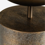 Close-up beneath the planting bowl showing its short metal stem and the mottled gold surface at the top of the pedestal.